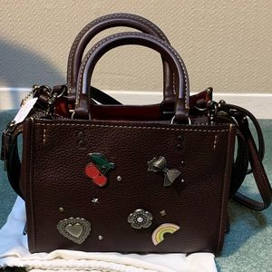 Coach Rogue 25 handbag with decorative pins